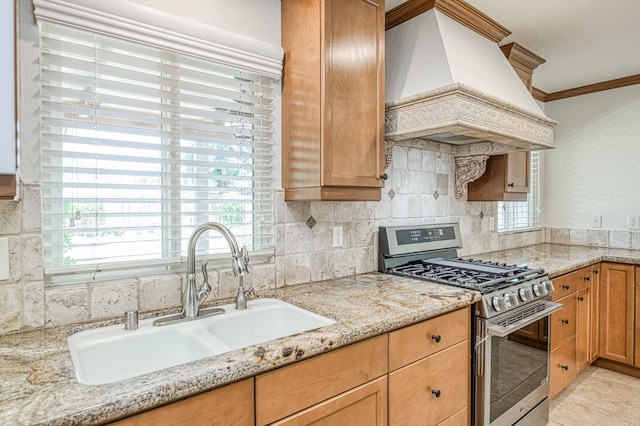 3348 W Sierra Ave, Fresno, CA 93711 - kitchen featuring stainless steel gas range oven, custom exhaust hood, ornamental molding, backsplash, and light stone counters