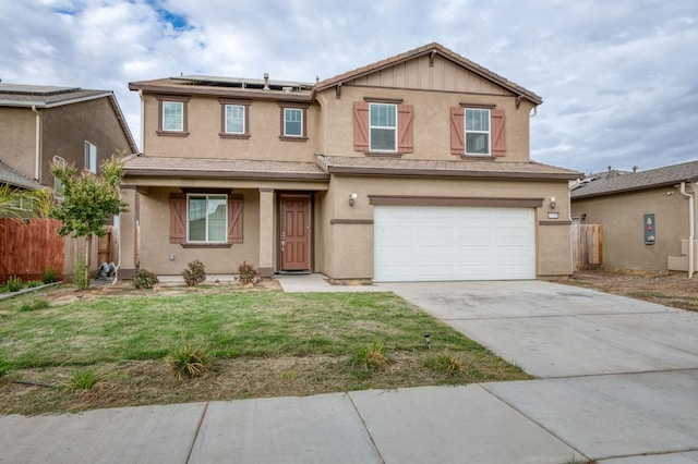 14288 W El Mar Ave, Kerman, CA 93630 - traditional-style home featuring roof mounted solar panels, an attached garage, driveway, and stucco siding