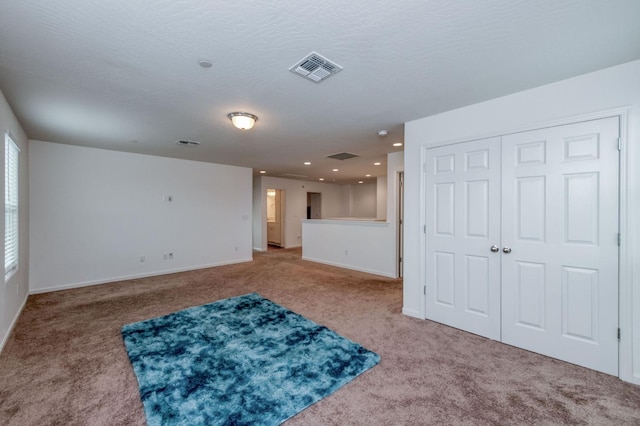 14288 W El Mar Ave, Kerman, CA 93630 - unfurnished living room with carpet and recessed lighting