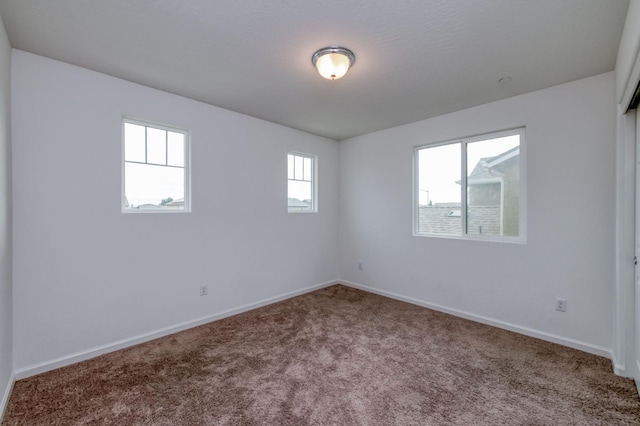 14288 W El Mar Ave, Kerman, CA 93630 - carpeted spare room featuring baseboards