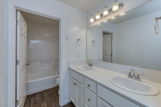 14288 W El Mar Ave, Kerman, CA 93630 - full bathroom featuring double vanity, wood finished floors, and shower / washtub combination
