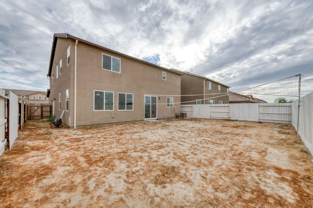 14288 W El Mar Ave, Kerman, CA 93630 - rear view of house with a fenced backyard and stucco siding