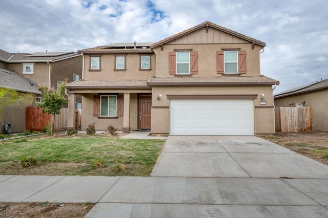 14288 W El Mar Ave, Kerman, CA 93630 - traditional-style home with roof mounted solar panels, an attached garage, stucco siding, and driveway