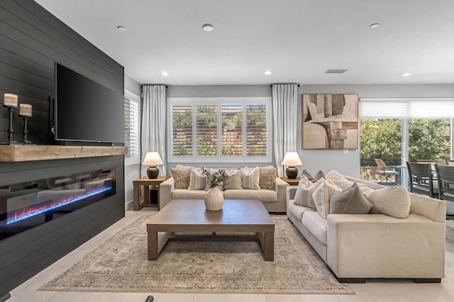 4349 Hillside Rd, Madera, CA 93636 - living room featuring a glass covered fireplace, plenty of natural light, and recessed lighting