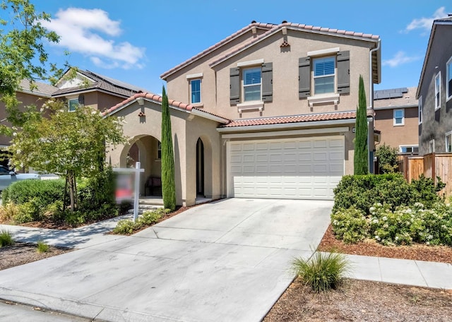 4349 Hillside Rd, Madera, CA 93636 - view of front of house featuring a tile roof, stucco siding, concrete driveway, and an attached garage