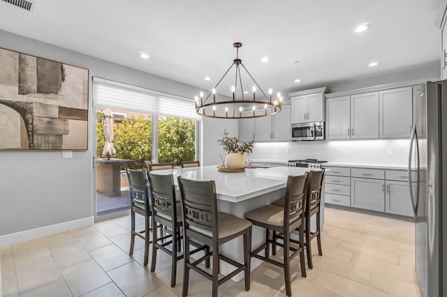 4349 Hillside Rd, Madera, CA 93636 - dining area featuring a chandelier, recessed lighting, and light tile patterned floors