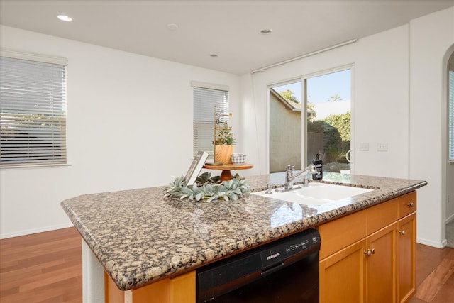 1935 N Glen Alva Ln, Clovis, CA 93619 - kitchen with black dishwasher, a center island with sink, wood finished floors, light stone countertops, and recessed lighting