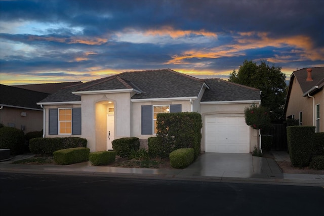 1935 N Glen Alva Ln, Clovis, CA 93619 - view of front of property featuring an attached garage, stucco siding, driveway, and a shingled roof