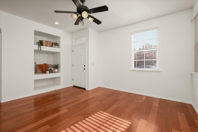 1935 N Glen Alva Ln, Clovis, CA 93619 - spare room featuring built in features, wood finished floors, recessed lighting, and a ceiling fan