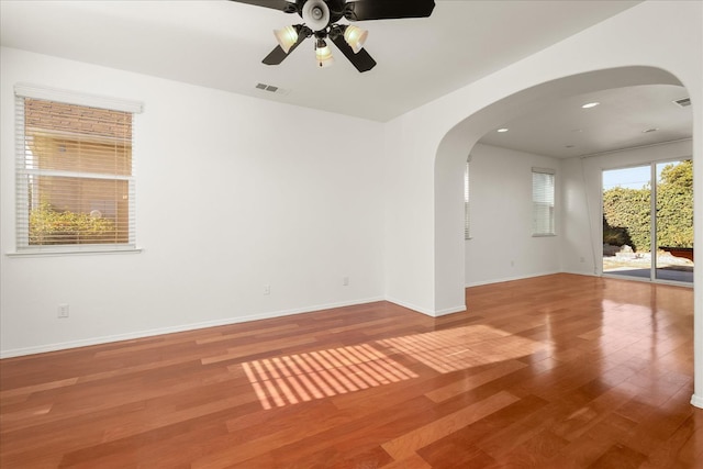 1935 N Glen Alva Ln, Clovis, CA 93619 - unfurnished room featuring wood finished floors, a ceiling fan, arched walkways, and recessed lighting