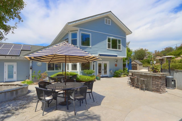 43295 Running Deer Dr, Coarsegold, CA 93614 - rear view of house featuring french doors, a patio area, outdoor dining area, and an outdoor structure