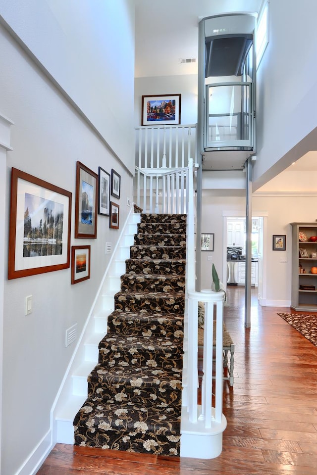 43295 Running Deer Dr, Coarsegold, CA 93614 - stairway with a towering ceiling and hardwood / wood-style flooring