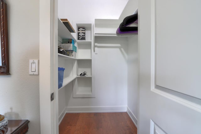 43295 Running Deer Dr, Coarsegold, CA 93614 - walk in closet with dark wood-style flooring