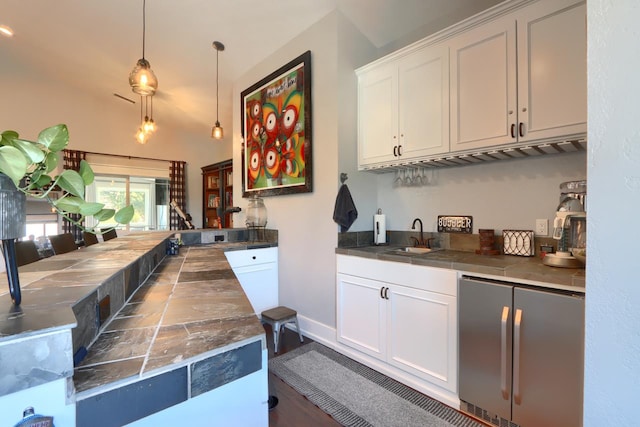 43295 Running Deer Dr, Coarsegold, CA 93614 - indoor wet bar featuring stainless steel fridge and pendant lighting