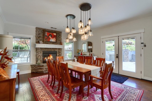 43295 Running Deer Dr, Coarsegold, CA 93614 - dining area with a stone fireplace, crown molding, dark wood-style floors, french doors, and a chandelier