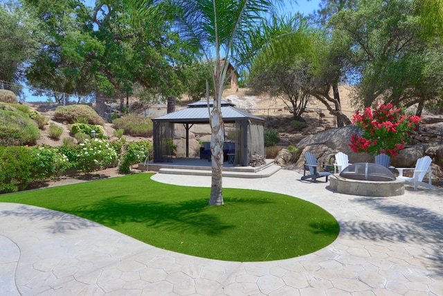 43295 Running Deer Dr, Coarsegold, CA 93614 - view of green lawn featuring an outdoor fire pit, a gazebo, and a patio area
