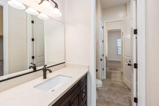 7399 N Riverside Dr, Fresno, CA 93722 - bathroom featuring toilet and vanity