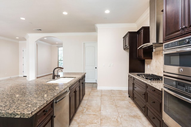7399 N Riverside Dr, Fresno, CA 93722 - kitchen featuring appliances with stainless steel finishes, arched walkways, stone counters, decorative backsplash, and recessed lighting