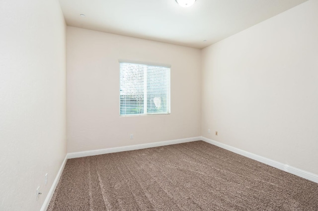 7399 N Riverside Dr, Fresno, CA 93722 - spare room with carpet flooring and baseboards