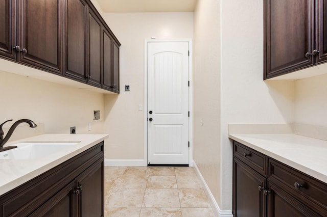 7399 N Riverside Dr, Fresno, CA 93722 - laundry area featuring cabinet space and electric dryer hookup