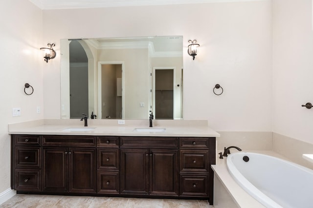 7399 N Riverside Dr, Fresno, CA 93722 - full bath featuring double vanity, a garden tub, and ornamental molding