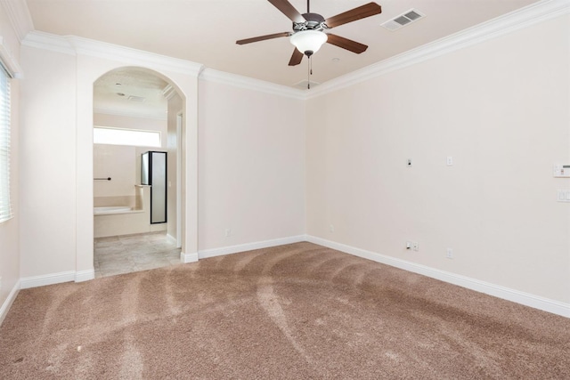 7399 N Riverside Dr, Fresno, CA 93722 - carpeted empty room with arched walkways, a ceiling fan, and ornamental molding