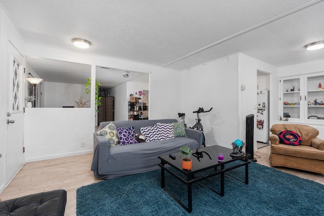 2575 S Willow Ave Unit 229, Fresno, CA 93725 - living room with wood finished floors and a textured ceiling