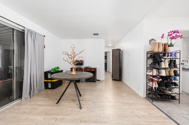 2575 S Willow Ave Unit 229, Fresno, CA 93725 - hall with light wood-style flooring and baseboards