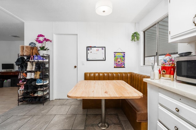 2575 S Willow Ave Unit 229, Fresno, CA 93725 - dining space featuring breakfast area and tile patterned floors