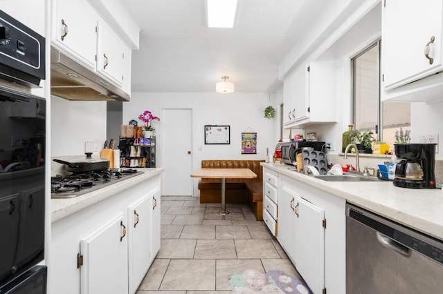 2575 S Willow Ave Unit 229, Fresno, CA 93725 - kitchen with stainless steel appliances, light countertops, white cabinets, and under cabinet range hood