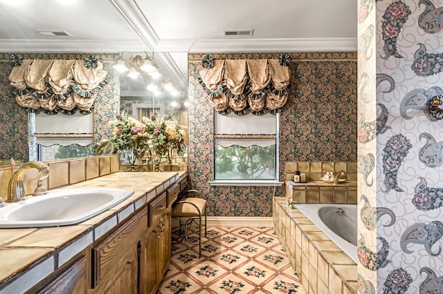 1917 Evergreen Pl, Madera, CA 93637 - bathroom with tiled tub, vanity, wallpapered walls, ornamental molding, and tile patterned floors