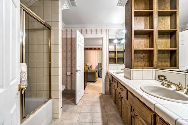 1917 Evergreen Pl, Madera, CA 93637 - bathroom with ornamental molding, double vanity, tile patterned flooring, shower / bath combination with glass door, and wallpapered walls