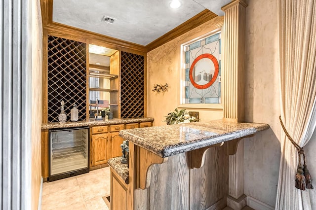 1917 Evergreen Pl, Madera, CA 93637 - wine room with wine cooler, bar, and crown molding