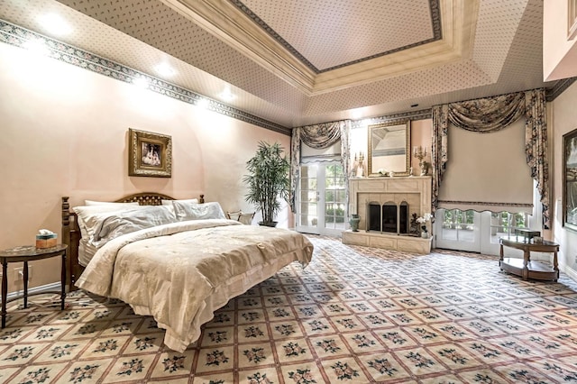 1917 Evergreen Pl, Madera, CA 93637 - carpeted bedroom featuring a towering ceiling, access to outside, a tray ceiling, crown molding, and a tiled fireplace