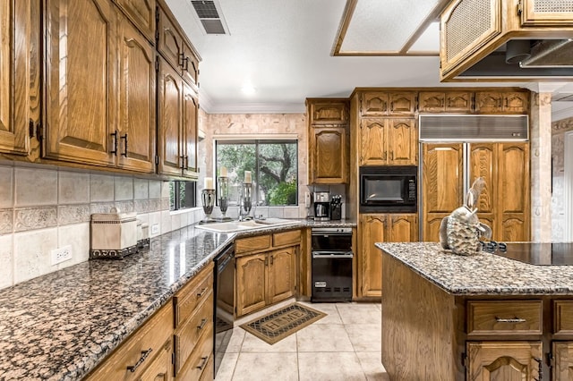 1917 Evergreen Pl, Madera, CA 93637 - kitchen featuring black appliances, brown cabinets, light tile patterned floors, backsplash, and crown molding