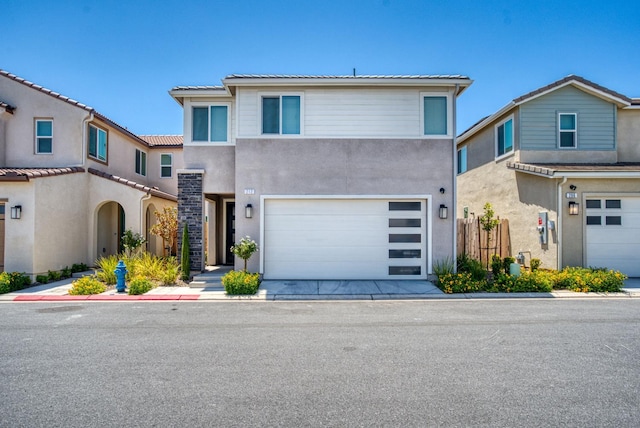 212 Arbor Dr S, Madera, CA 93636 - view of property featuring a garage and stucco siding