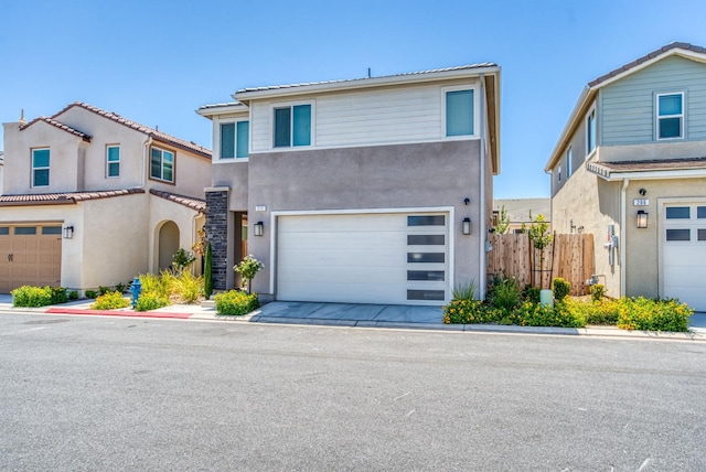 212 Arbor Dr S, Madera, CA 93636 - view of front facade with stucco siding and an attached garage