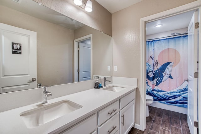 212 Arbor Dr S, Madera, CA 93636 - bathroom featuring double vanity, wood finished floors, and a shower with shower curtain