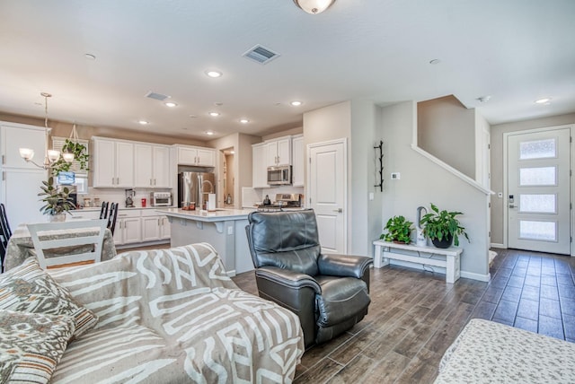 212 Arbor Dr S, Madera, CA 93636 - living area featuring dark wood-type flooring, a chandelier, and recessed lighting
