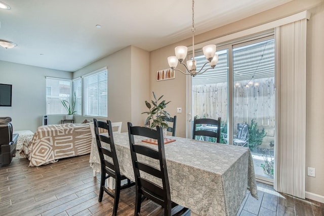 212 Arbor Dr S, Madera, CA 93636 - dining area with healthy amount of natural light, a chandelier, and wood finished floors