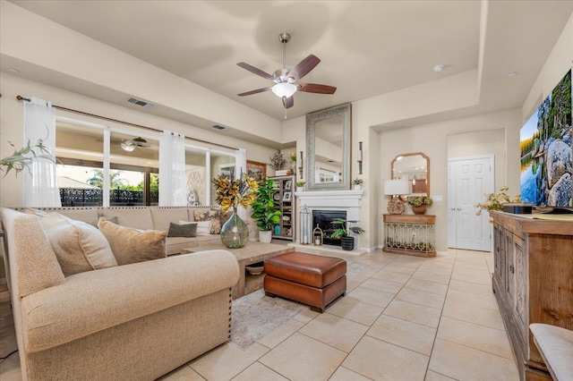 3982 Flint Ave, Clovis, CA 93619 - living room with a ceiling fan, light tile patterned flooring, and a large fireplace