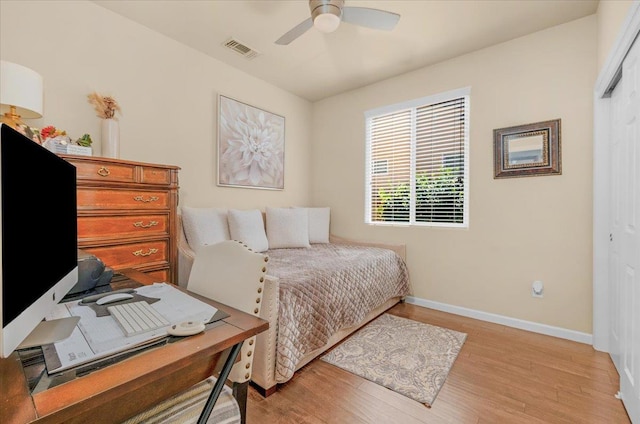 3982 Flint Ave, Clovis, CA 93619 - bedroom featuring light wood finished floors, a closet, a desk, and ceiling fan