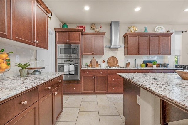 3982 Flint Ave, Clovis, CA 93619 - kitchen featuring stainless steel appliances, wall chimney exhaust hood, tasteful backsplash, light stone countertops, and recessed lighting