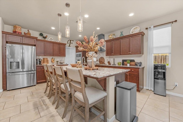 3982 Flint Ave, Clovis, CA 93619 - kitchen with appliances with stainless steel finishes, light tile patterned floors, decorative light fixtures, a center island with sink, and wall chimney range hood