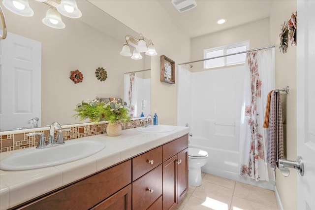 3982 Flint Ave, Clovis, CA 93619 - full bathroom featuring tile patterned flooring, double vanity, shower / tub combo, and decorative backsplash