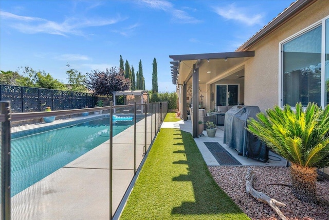 3982 Flint Ave, Clovis, CA 93619 - view of pool featuring a fenced backyard, outdoor lounge area, a patio, and area for grilling