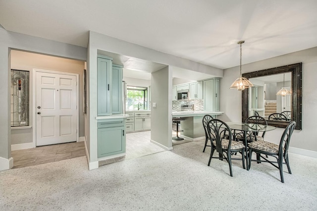 7047 N Teilman Ave Unit 102, Fresno, CA 93711 - dining room featuring baseboards