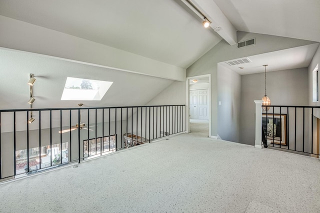 7047 N Teilman Ave Unit 102, Fresno, CA 93711 - hall featuring track lighting, a skylight, and carpet floors