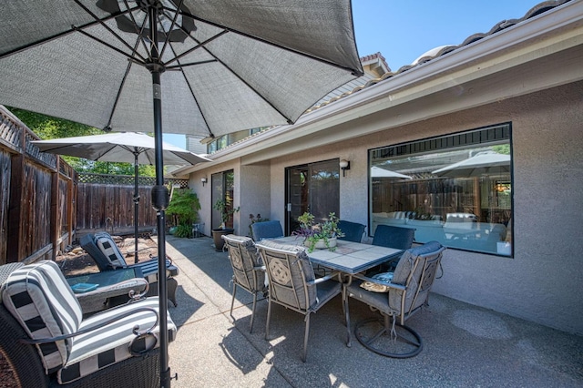 7047 N Teilman Ave Unit 102, Fresno, CA 93711 - fenced backyard with a patio area and outdoor dining area