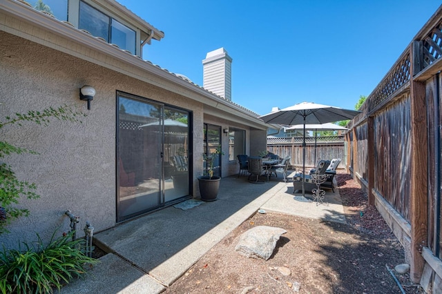 7047 N Teilman Ave Unit 102, Fresno, CA 93711 - fenced backyard featuring a patio